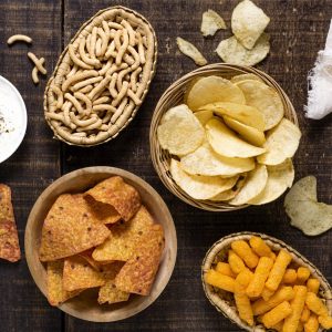top-view-assortment-chips-with-sauce